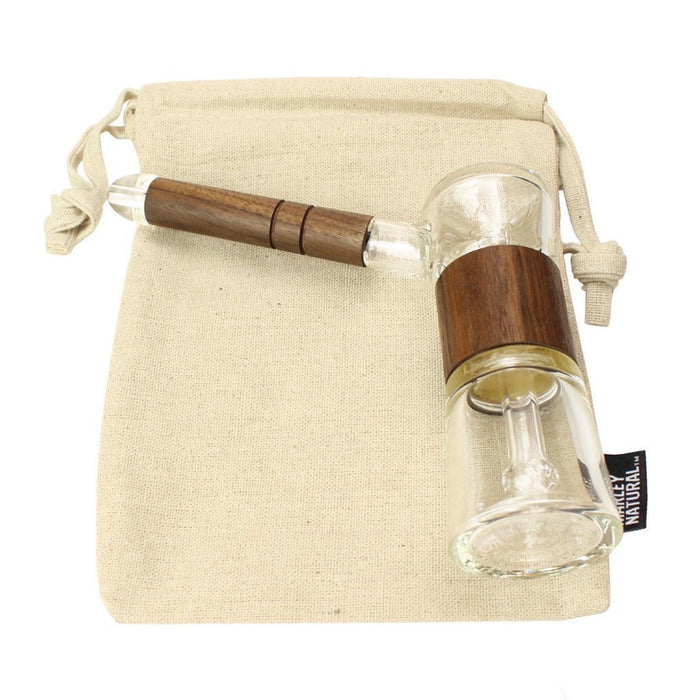 a small glass bottle with a wooden handle