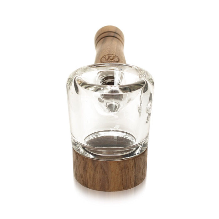 a glass bottle with a wooden stopper