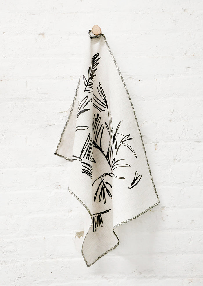 Screen Printed Palm Leaf Linen Tea Towel Hanging On Hook - LEIF