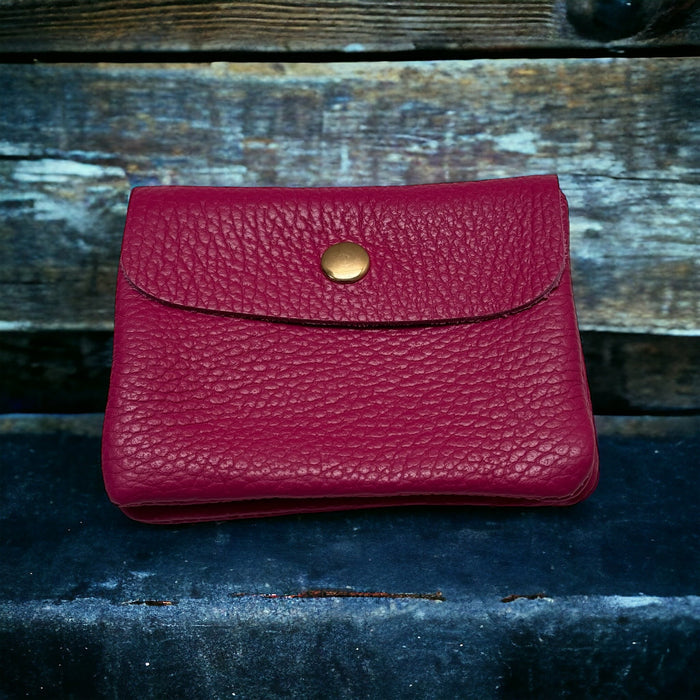 Magenta pebble-leather mini wallet, snap-flap front with gold-tone button