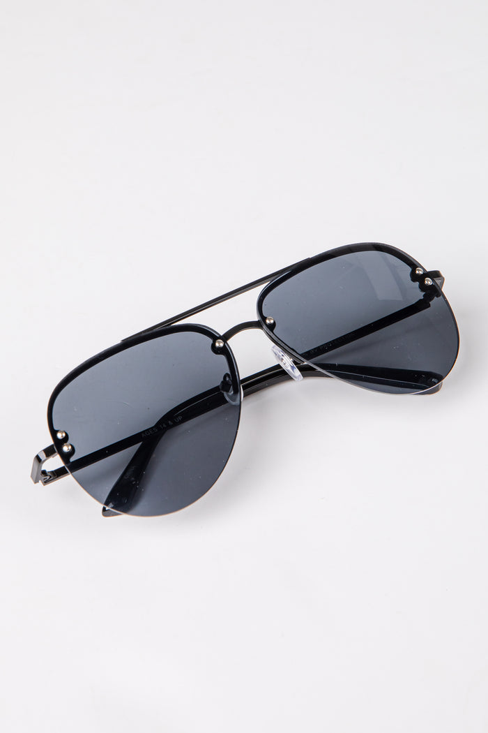 Black sunglasses with dark lenses on a white background