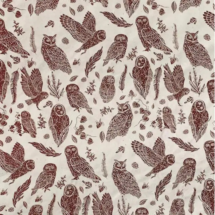 Rust brown owl and feather block print pattern on cream Nepali bark paper wrap sheet