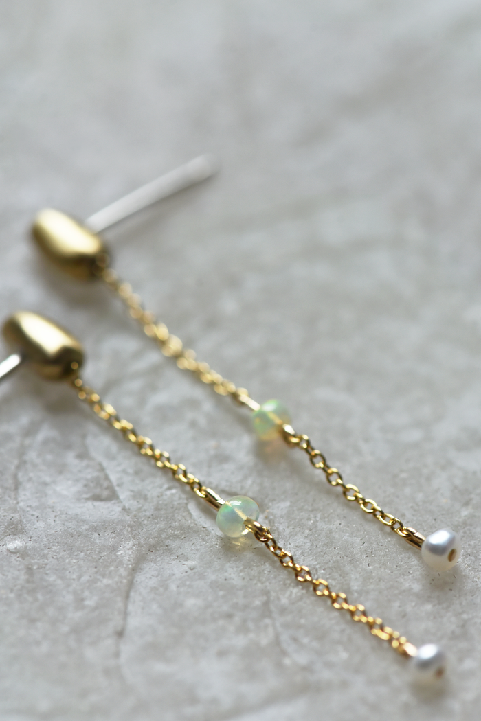 Pair of gold-tone chain drop earrings with green opal bead and white pearl end