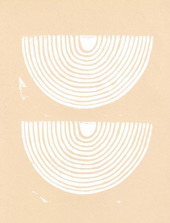 A peach canvas features two upside down white rainbows.