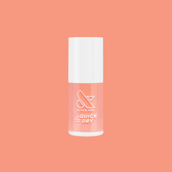 Peeptoe quick dry nail polish bottle in warm peach shade against matching smooth peach background