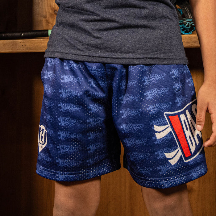 Youth model wearing red Pennant USA youth shorts