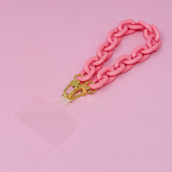 Ellison+Young phone wrist lanyard with adjustable strap and metal clasp, designed for secure and stylish phone carrying.