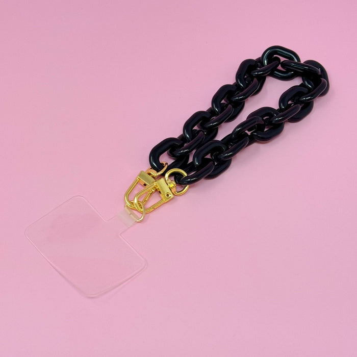 Ellison+Young phone wrist lanyard with adjustable strap and clip, designed for secure carrying of smartphones and devices.