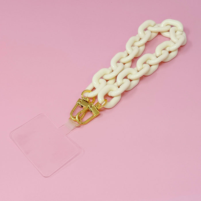 Ellison+Young phone wrist lanyard with adjustable strap and metal clasp, designed for secure carrying of smartphones or small accessories.