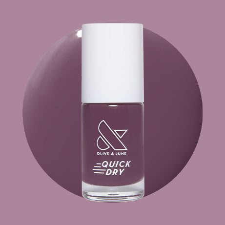 Olive and June Plum quick dry gel polish bottle with dark warm purple swatch on mauve background