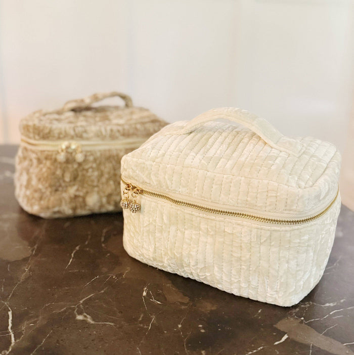 Ellison+Young quilted velvet vanity case with zipper closure and compact design, featuring a soft, textured velvet exterior.