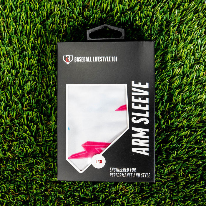 Youth model wearing white and pink and blue Rain Delay Lightning Arm Sleeve youth sleeve