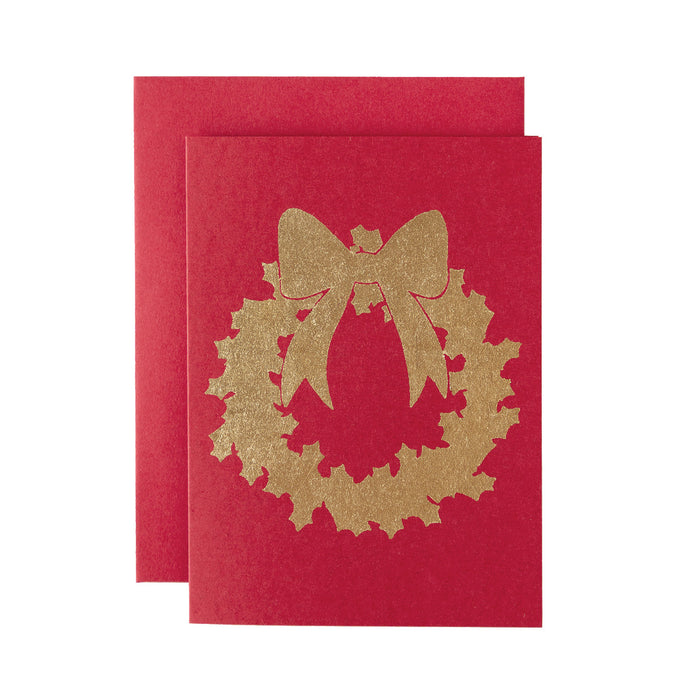A gold-leaf Christmas Wreath with a bow on a red greeting card, with a matching red envelope.