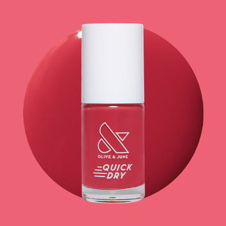Roar quick dry gel polish bottle with bold pinky red color swatch on matching pink background