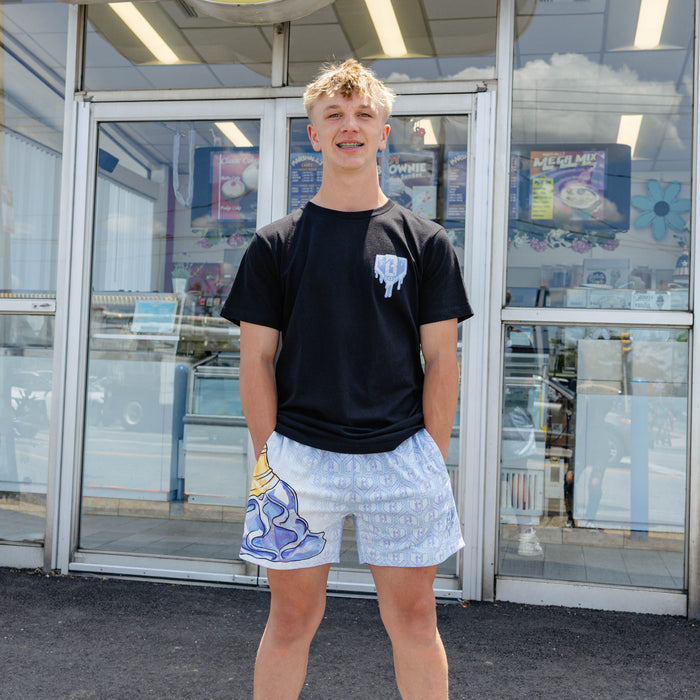 Adult model wearing shorts with "Scoop SZN" design