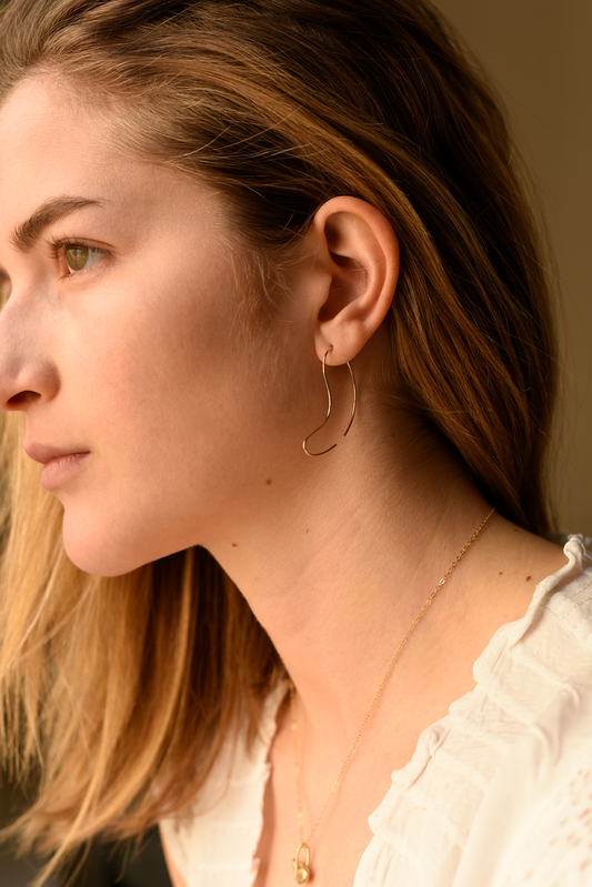 Large sculpted curve hoop threader earrings, thin gold-tone wire with curved drop shape