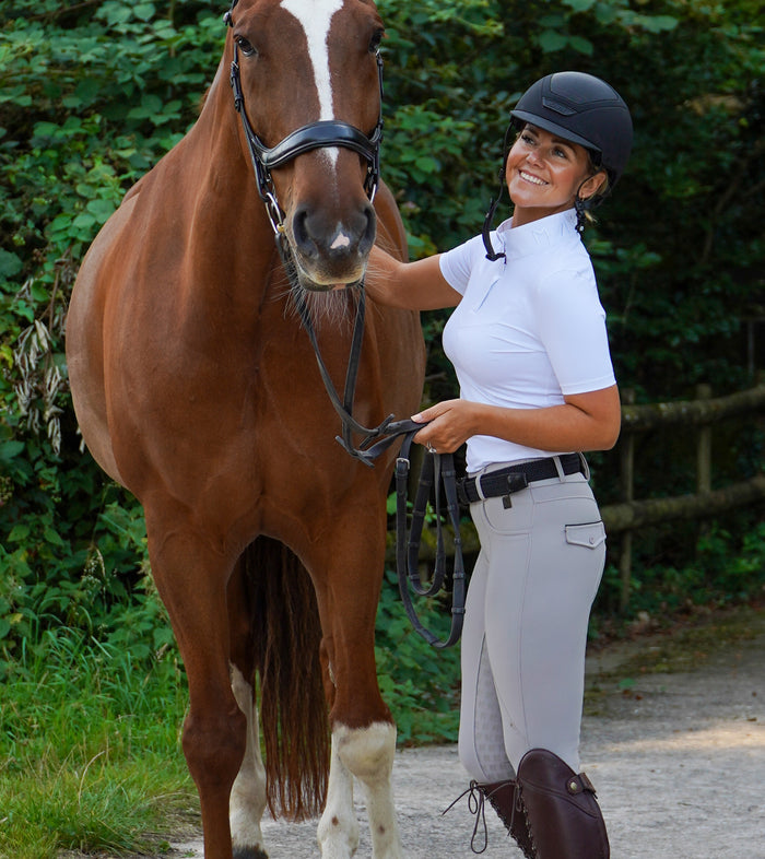 Premium stone beige competition breeches with a Full Silicone seat. Stretch high waisted Jodhpurs. Deep pockets, supportive, comfortable and compression quality fabric. Elegant detailing with subtle branding.
