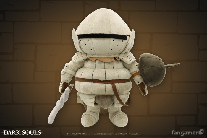 The official Siegmeyer plush glowing subtly against an illustrated brick background, showing its magnetically attached plush sword and elastic-banded plush shield accessories.