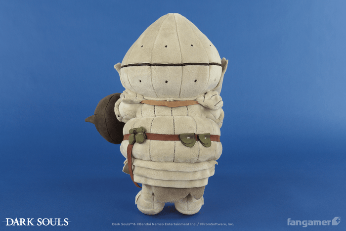 A photograph of the Siegmeyer plush from behind, showing a number of plush pockets and sacks attached to its belt as well as the back of its armor.