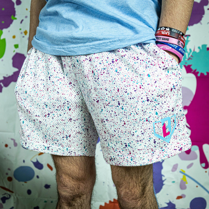 Adult model wearing white shorts with “Splatter” design