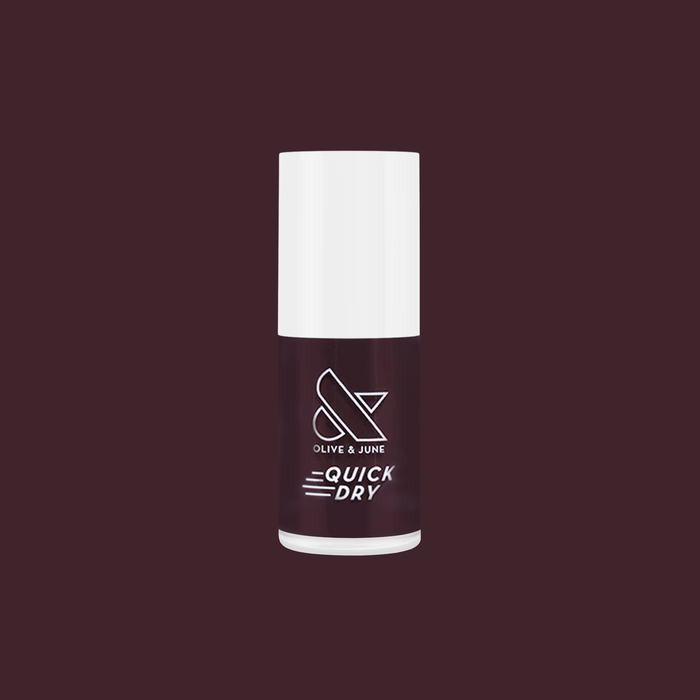 Spressotini quick dry gel polish bottle in dark coffee brown shade against deep plum background