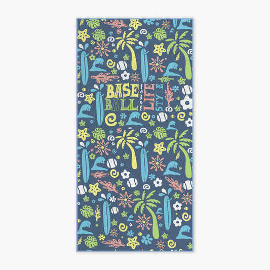 A rectangular beach towel featuring a colorful tropical and baseball-themed pattern on a slate blue background. The design includes palm trees, surfboards, baseball bats, flowers, and the words 'BASEBALL LIFE STYLE' in a playful multicolor font.
