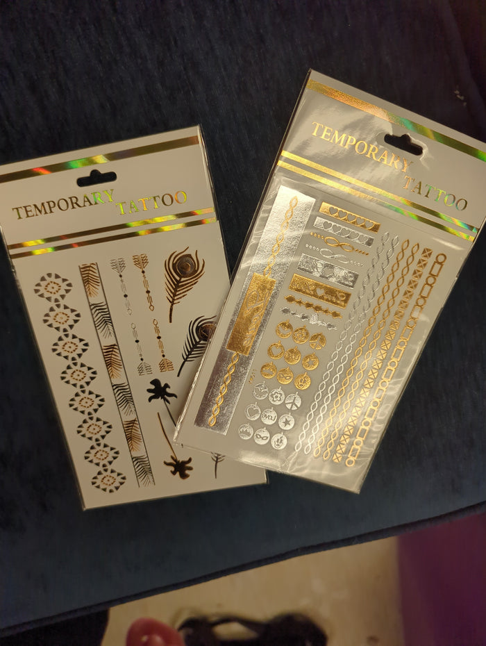 Joia Tatted Up temporary tattoos featuring intricate tattoo-style designs on skin for bold, stylish body art.