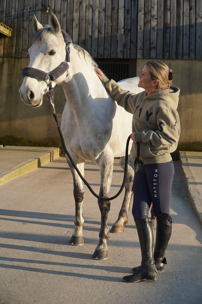 High quality luxurious 100% cotton. wrap around bold logo. soft, cozy and  warm. Hoodie, jumper sweatshirt. everyday wear. casual and smart. Gtreen Hoodie, woman standing with horse