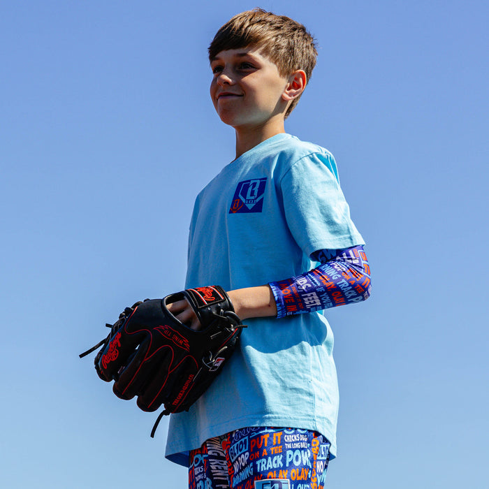 Youth model wearing multi-color youth arm sleeve with "Trash Talk Youth" design