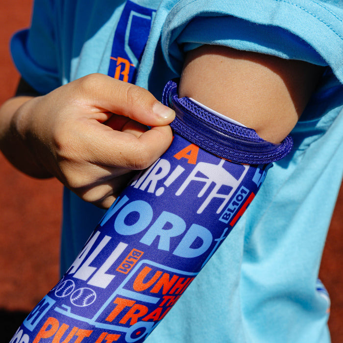 Youth model wearing multi-color youth arm sleeve with "Trash Talk Youth" design