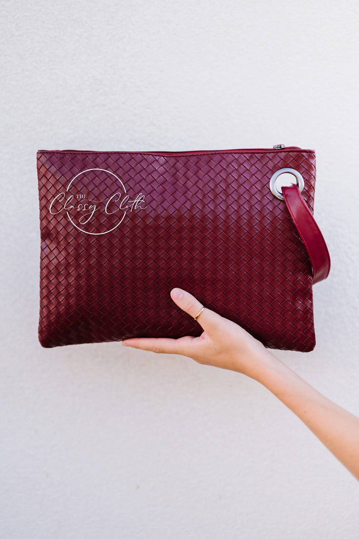 Trendy Weave Wine RTS clutch bag by The Classy Cloth WS featuring a woven design and compact style for versatile occasions.