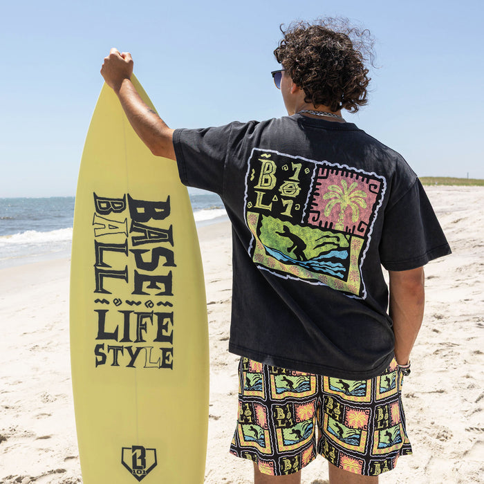 Adult model wearing black graphic tee with "Wave Goodbye" design