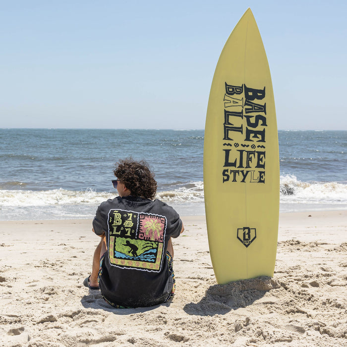Adult model wearing black graphic tee with "Wave Goodbye" design