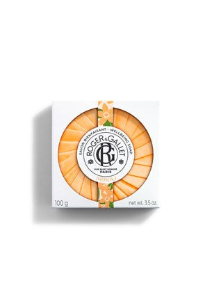Neroli wellbeing soap in orange round bar with Roger&Gallet logo on label