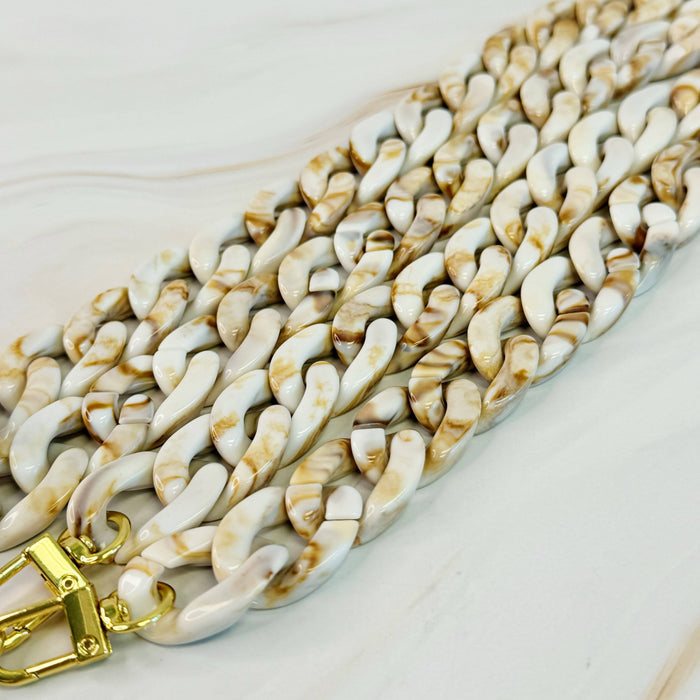 Ellison+Young Wink Phone Lanyard with stylish chain and strap for secure, hands-free phone carrying and easy access.
