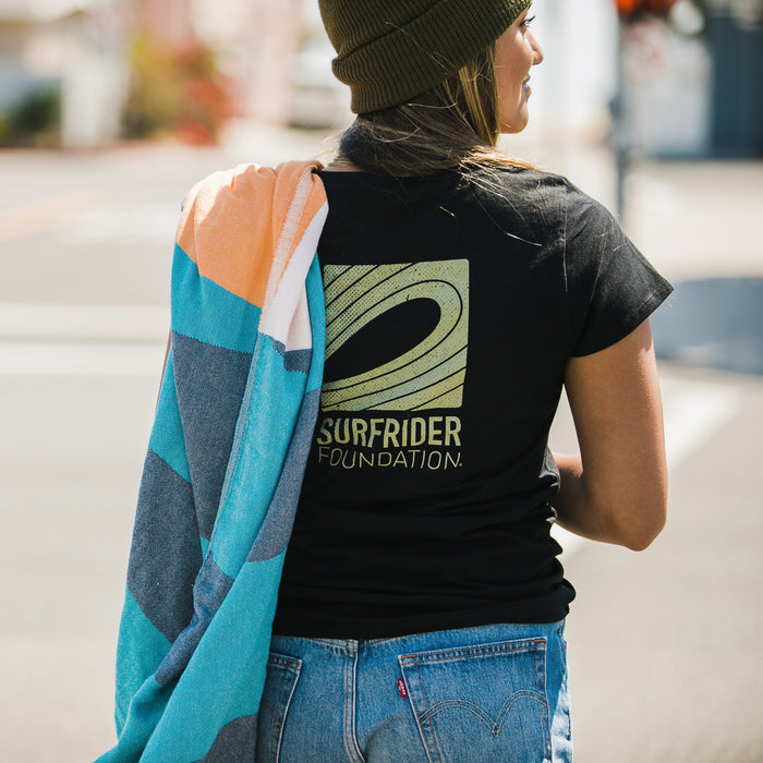 Back detail of graphic tee on model.